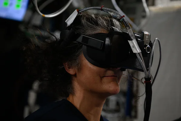 Astronaut Suni Williams wears a virtual reality headset during spacewalk training