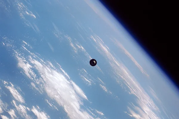 View of the SBS-4 communications satellite in orbit above the earth
