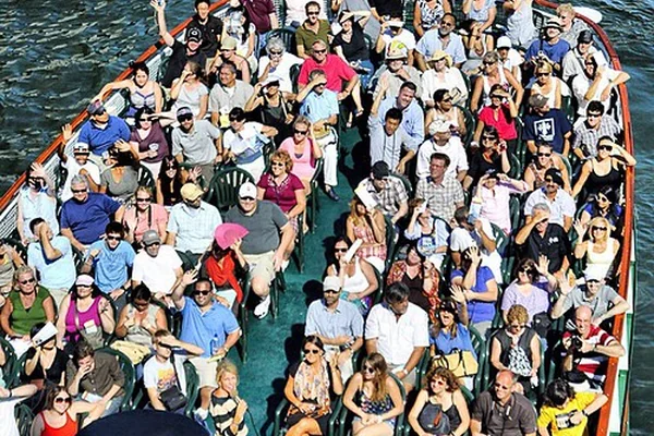While crossing a bridge in Chicago with some friends I saw this tour boat approaching and, without thinking twice, leaned over the edge and yelled 'Everybody Wave!!!' and took this image. All of my friends laughed hysterically at my bold and socially awkw