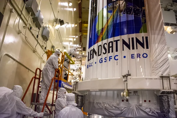 Landsat 9 Fairing Contamination Barrier and Access Door Removal