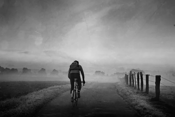 Cyclist in Morning Mist