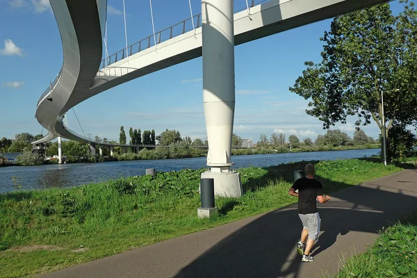 2011.07 - 'Photo of modern bridge architecture - a narrow long bridge with floating construction, built for pedestrians and cyclists over the canal Amsterdam/Rijnkanaal; geotagged photo in the public domain