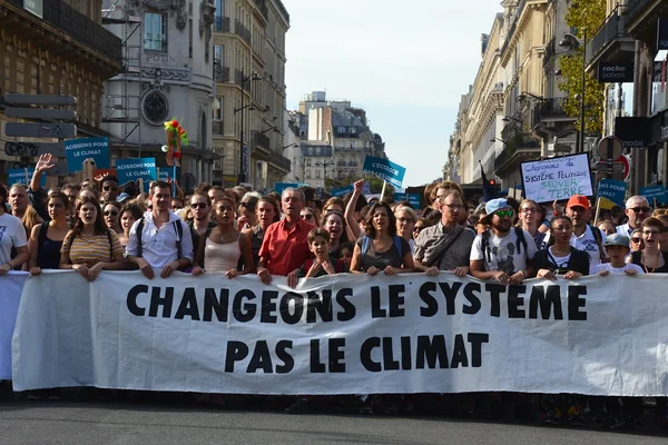 Climate change protesters march in Paris streets