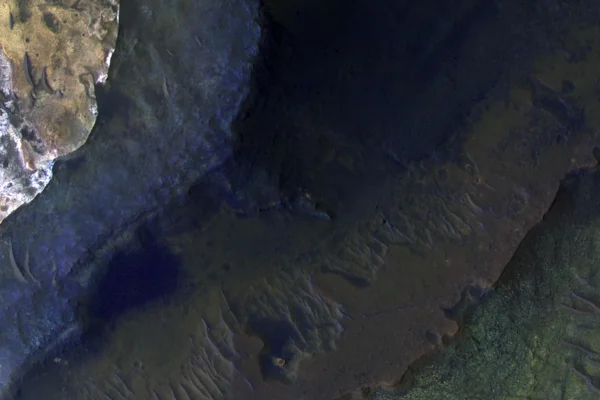 Hematite-Rich Deposits in Capri Chasma
