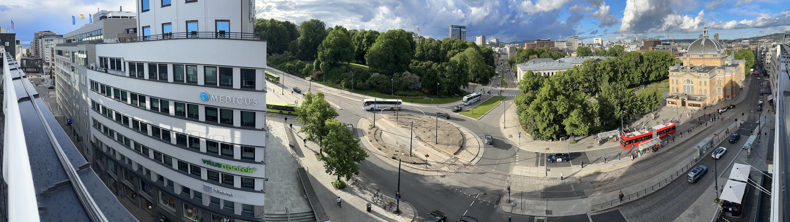 OSLO Norway 2026-06-10 Rooftop cityscape view from Odd Fellow (Stortingsg 28) Konserth. Munkedamsv. Torstedgården Medicus Slottsparken Abelhaugen Henrik Ibsens g roundabout Frederiks g Nationalth. J Dybwad University bus Distorted pa